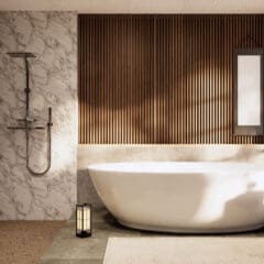 Modern bathroom featuring a freestanding white bathtub and tall narrow mirror on a wood-paneled wall. A lantern and small wooden table with a plant are beside the tub. Expertly done bathroom installations ensure the shelves hold towels and toiletries securely, while a window lets in natural light.