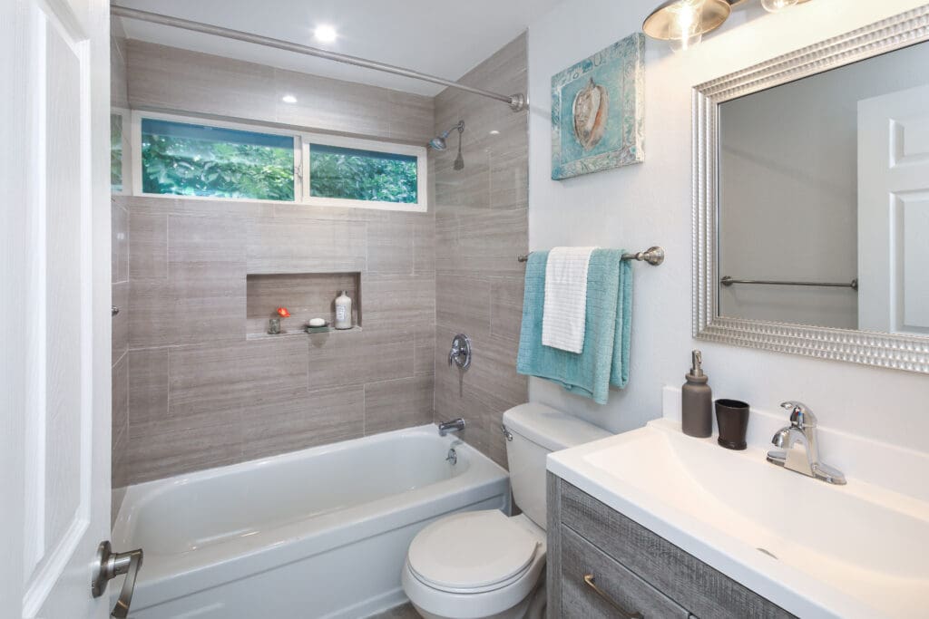Contemporary grey and white bathroom with vanity cabinet.