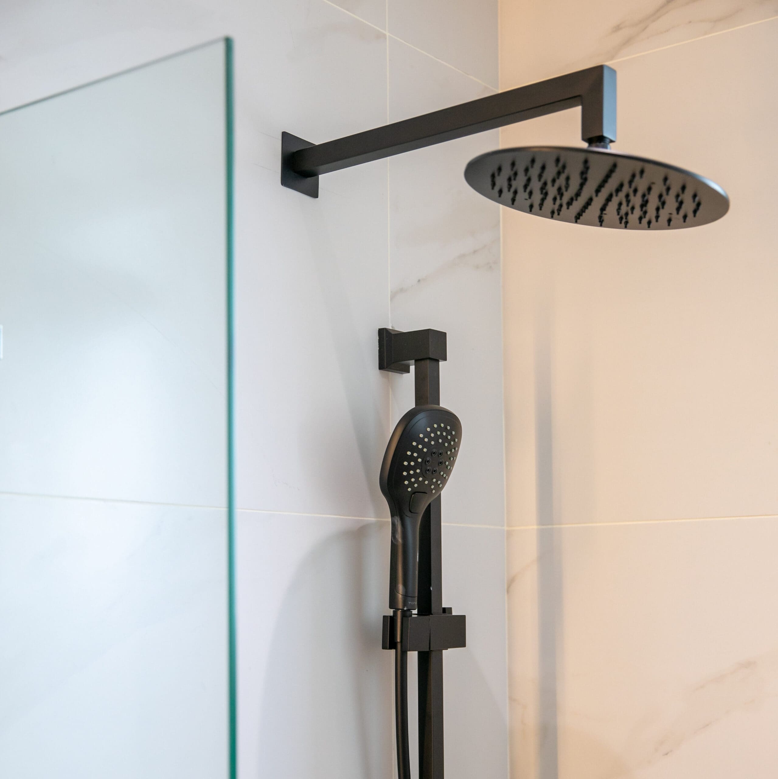 black shower head in a bathroom