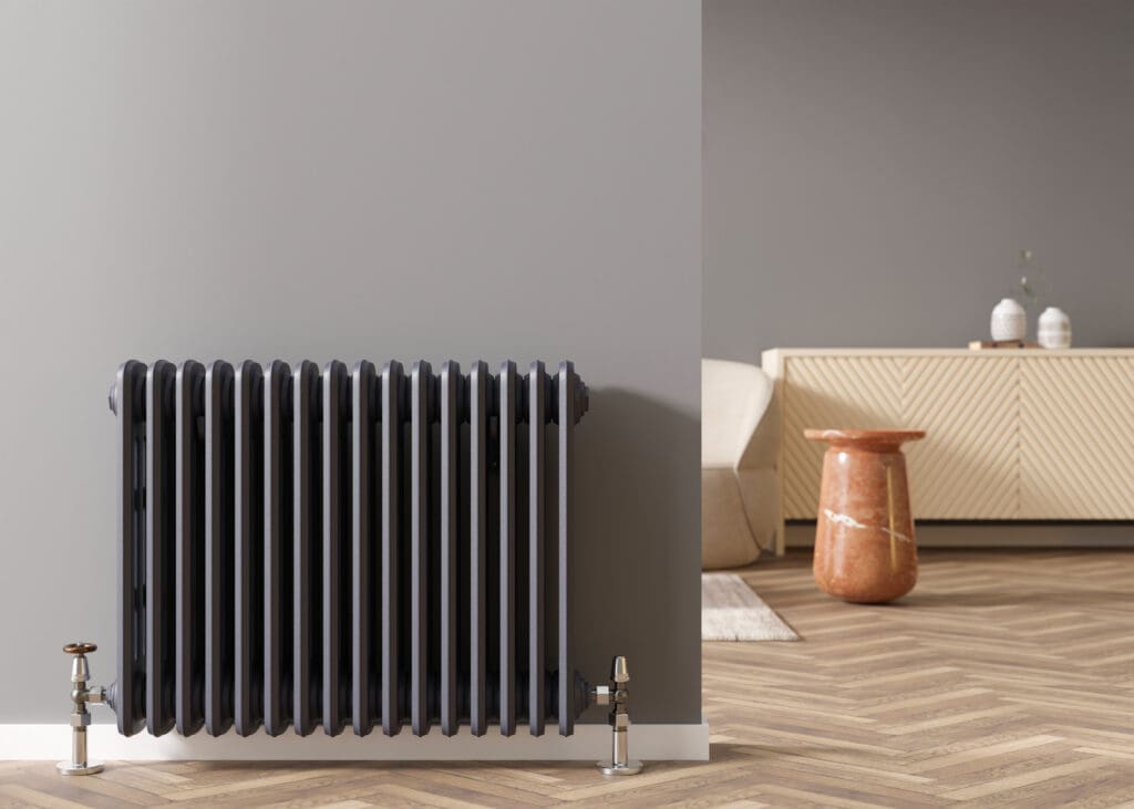 Heating radiator on gray wall in modern room. Home interior. Central heating system. Heating is getting more expensive. Energy crisis. 3D rendering
